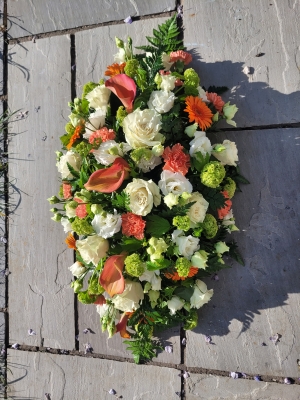 Orange Green and White Casket Spray