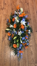 Blue orange and white casket spray