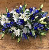 Blue and white casket spray