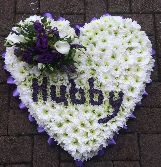 heart tribute with letters in flowers