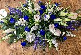 Mixed blue and white casket spray