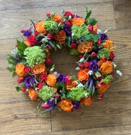 Orange green and purple wreath